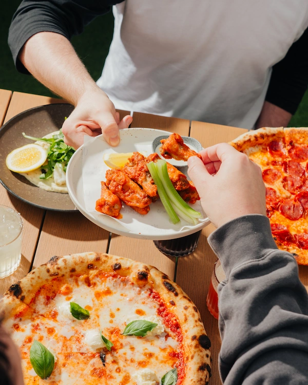 Plated food, drinks and pizza